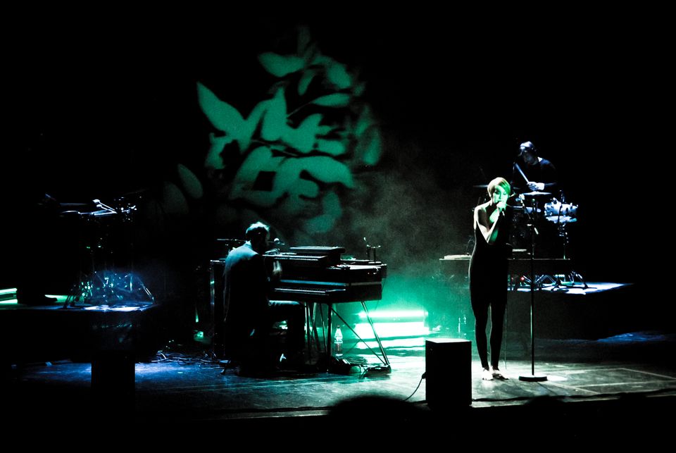 Hundreds on stage with visual in background